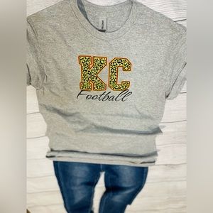 KC football shirt, cheetah print, yellow, red, black, football,
